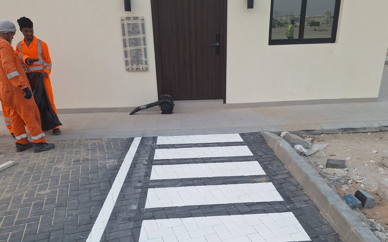 Completed pedestrian crossing on interlock paving at a chalet frontage