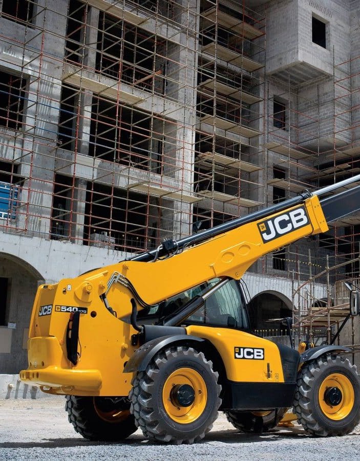 Heavy plant working at a building site alongside the structure