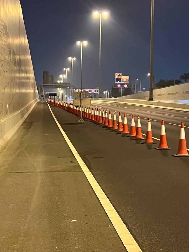 Long cone line along a tunnel lane