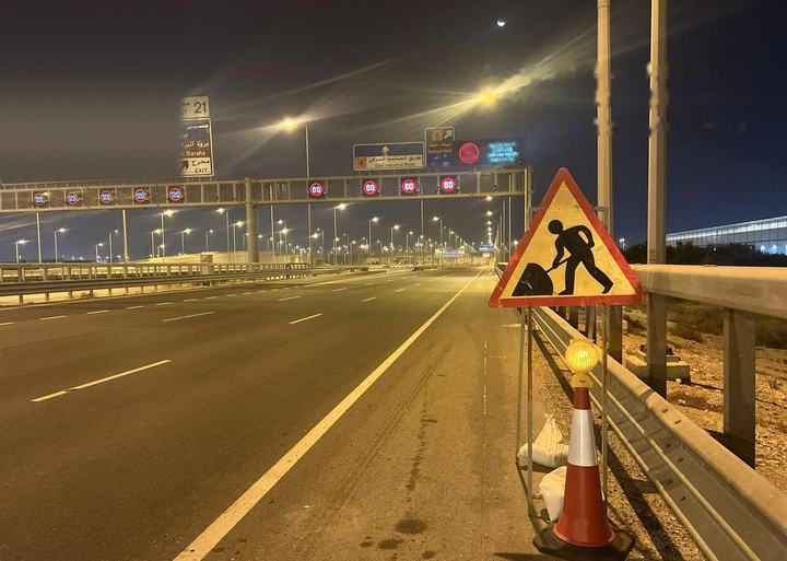 Roadworks sign with warning beacon at a diversion