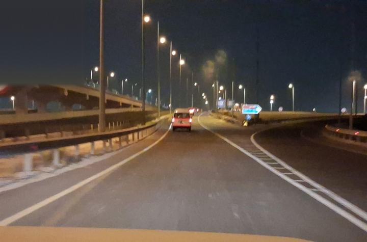 Cone-lined closure on a night approach road