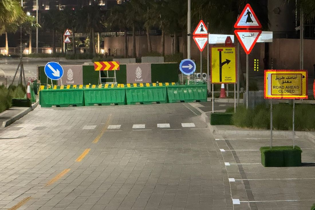 Signed traffic diversion with barriers on a Doha road